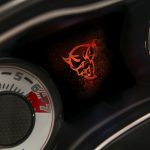 The Demon logo startup screen displayed on the 2018 Dodge Challenger SRT Demon’s 7-inch instrument cluster screen centered between the exclusive SRT Demon white face gauges.