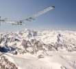 Solar Impulse 2 flying over a mountain range